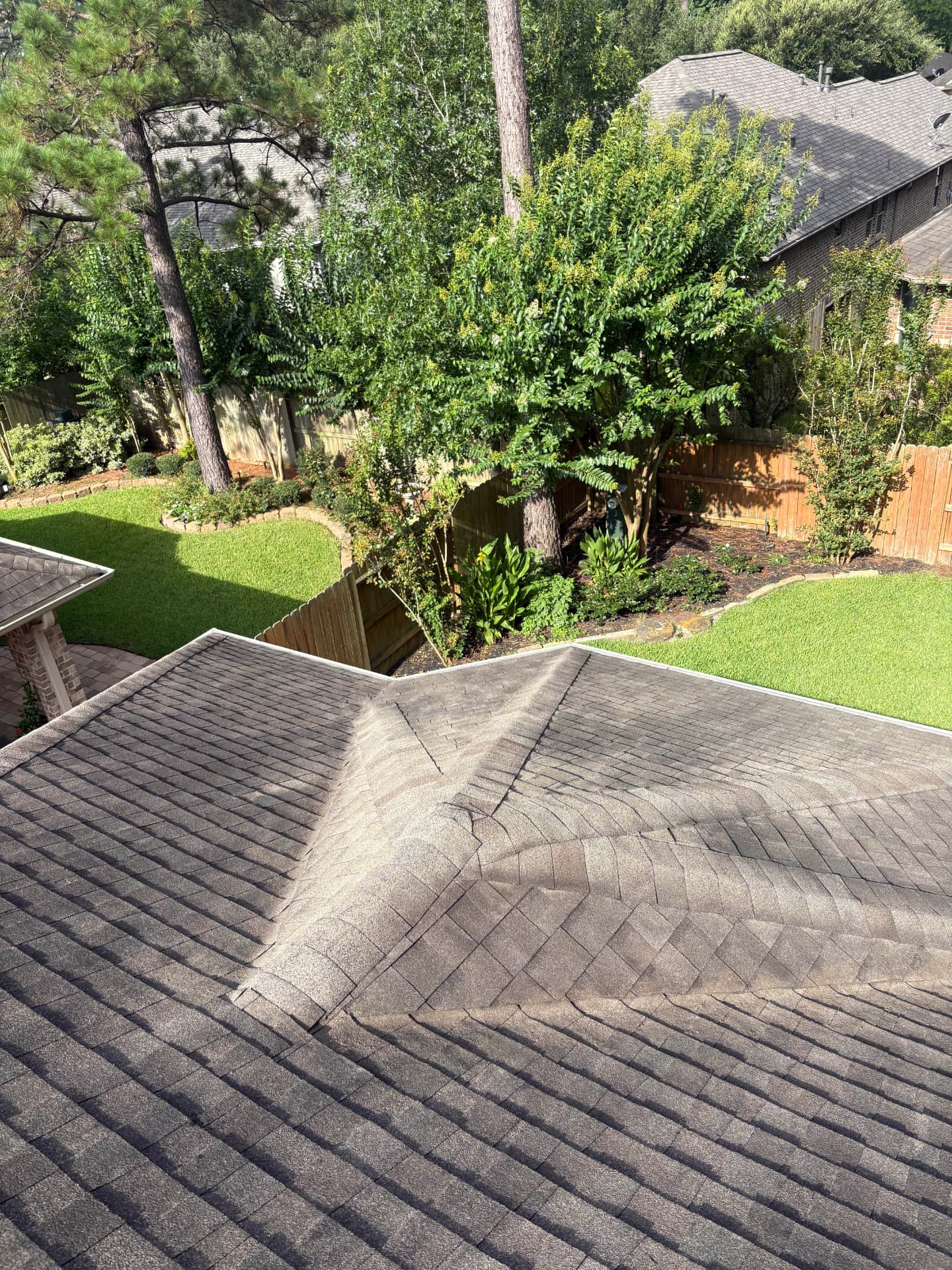 Roof sections with faint streaks along the shingles — Integrative Services, Montgomery TX