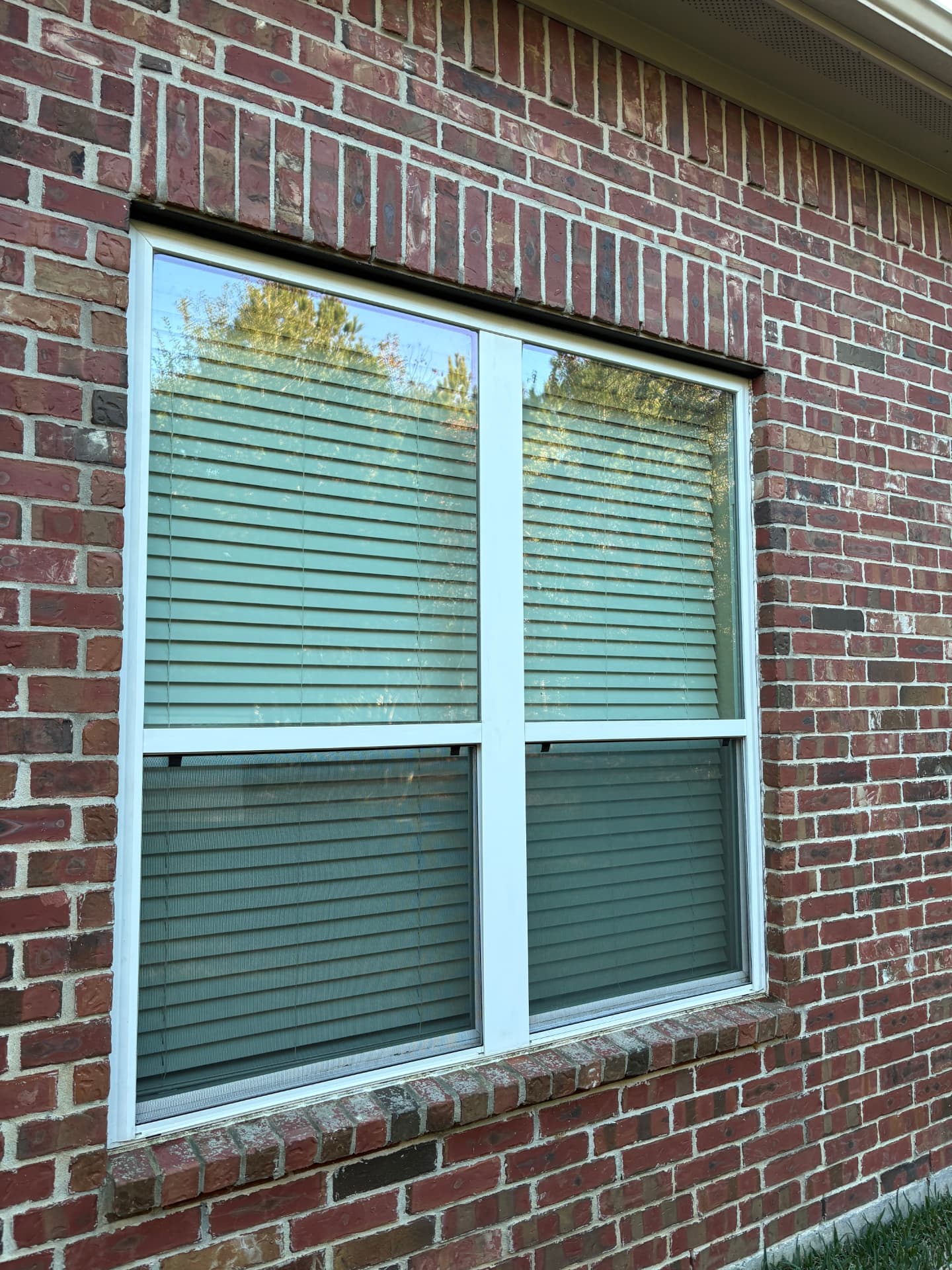 Window on a red brick wall after a clean — Integrative Services, Montgomery TX