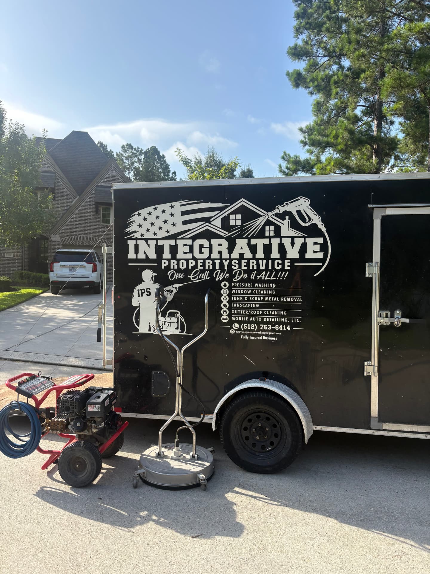 Integrative trailer with pressure washing equipment parked on a job site — Integrative Services, Montgomery TX