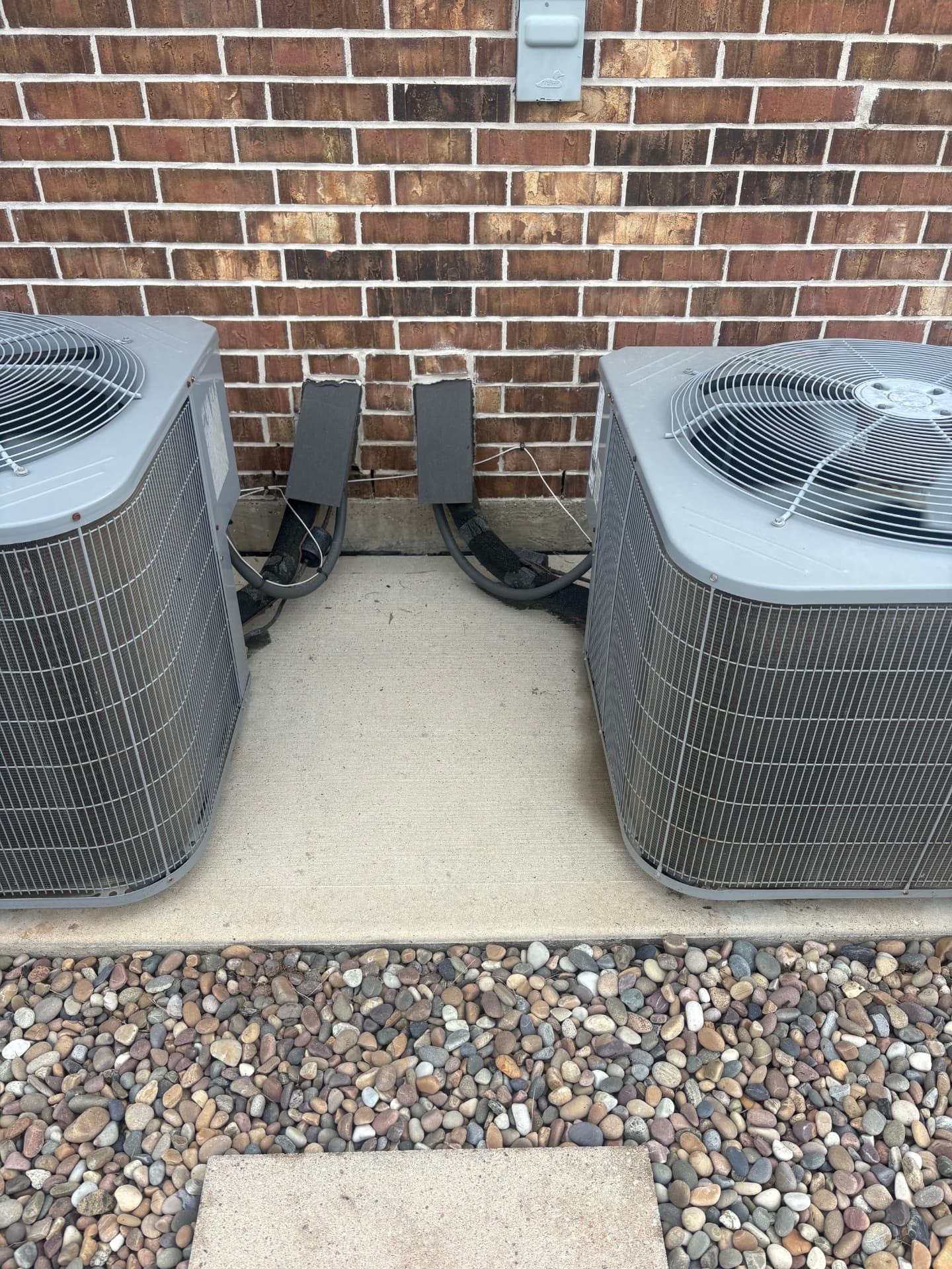 Clean concrete around two air conditioning units — Integrative Services, Montgomery TX