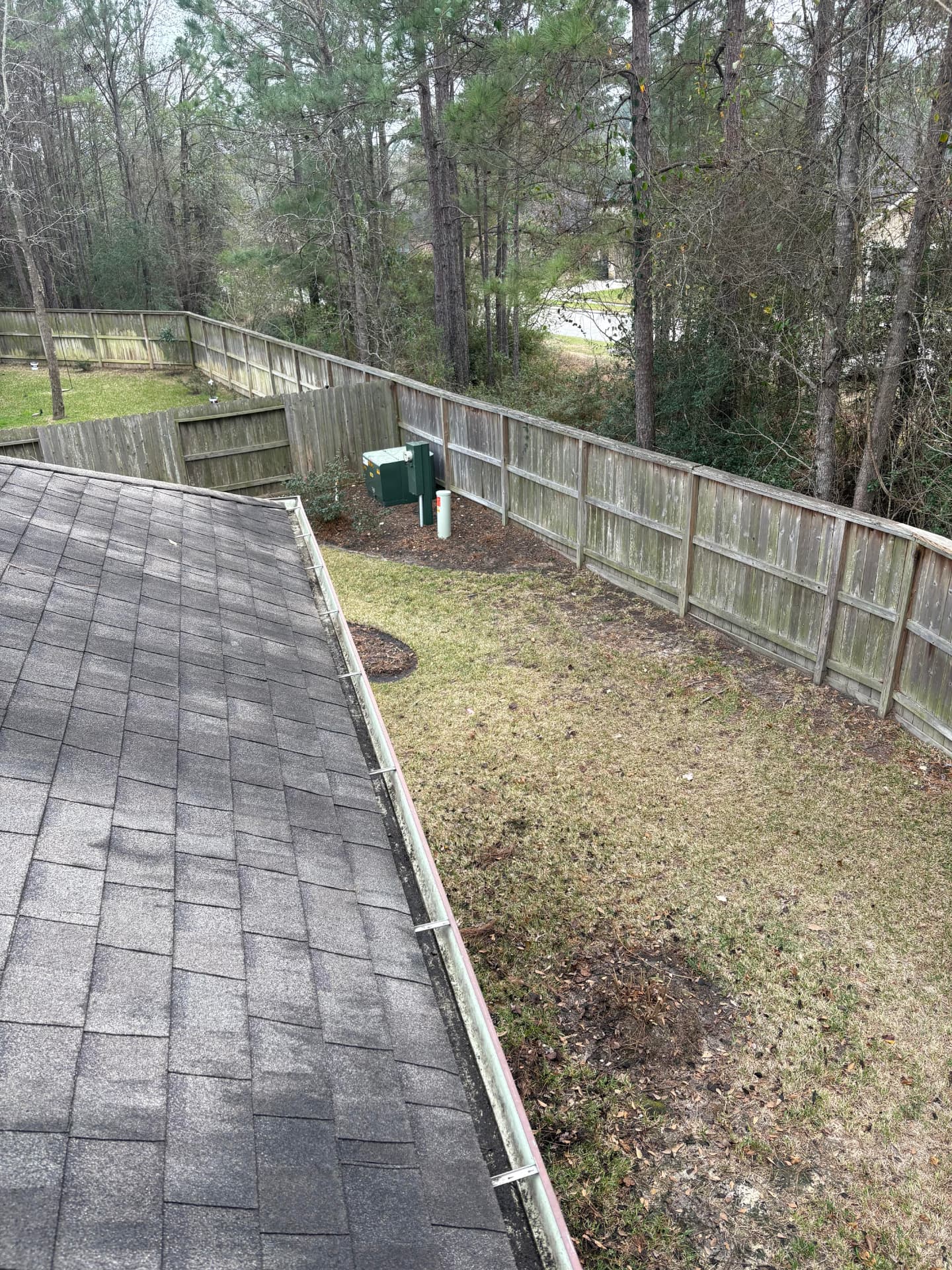 Gutter line along a roof edge — Integrative Services, Montgomery TX