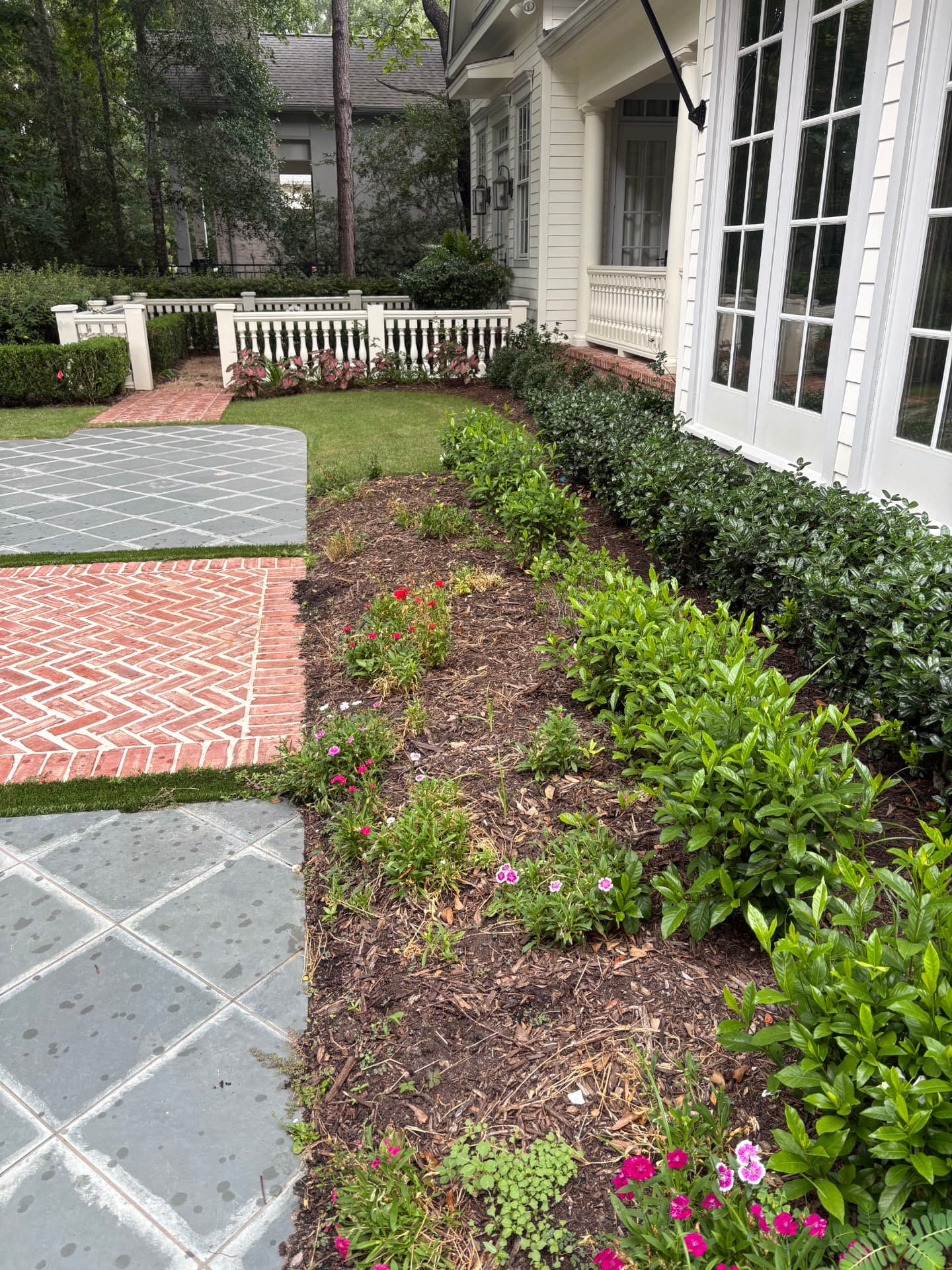 Freshly landscaped beds along a brick walkway — Integrative Services, Montgomery TX