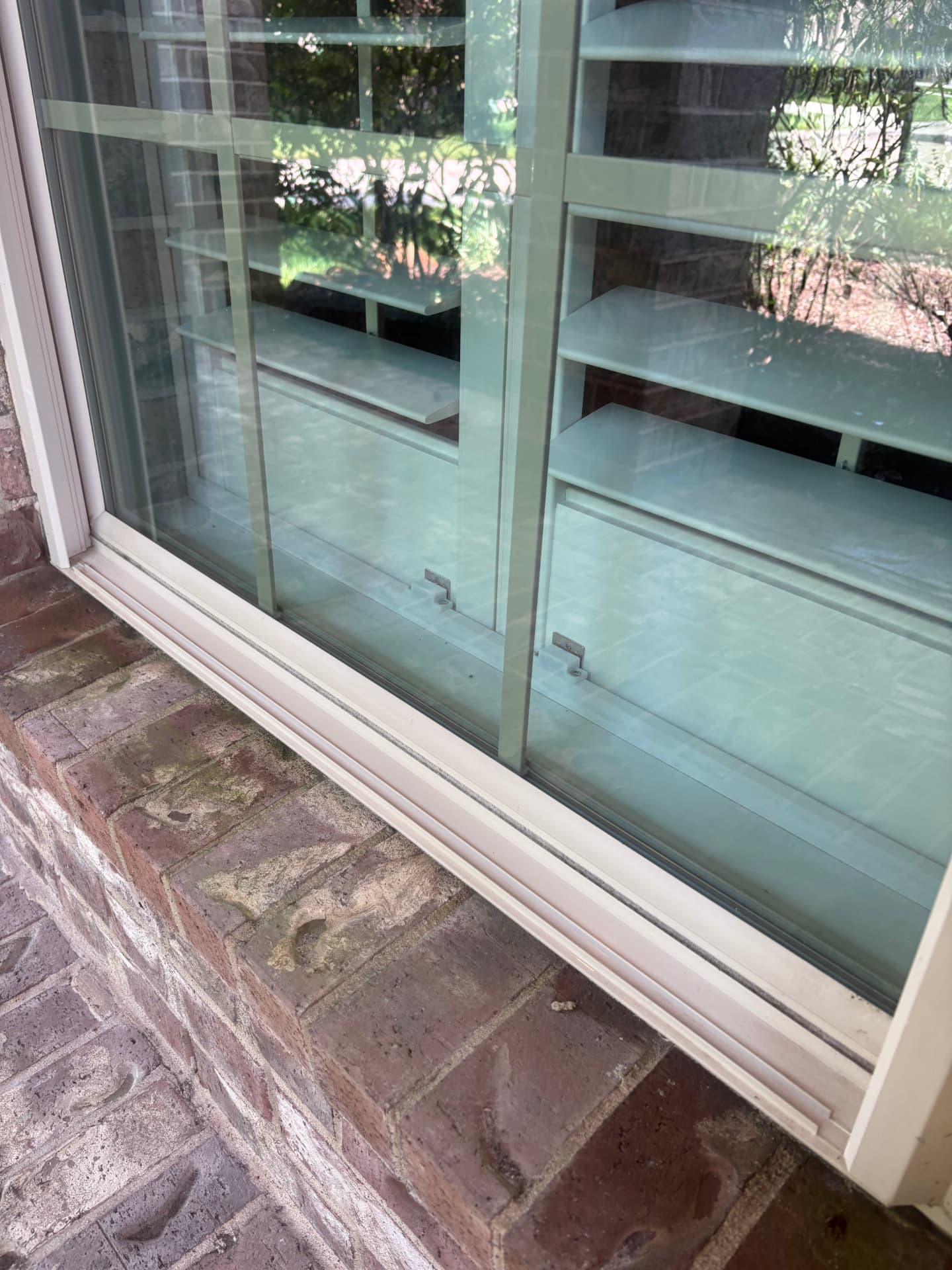Window track on a brick sill with grime before a clean — Integrative Services, Montgomery TX
